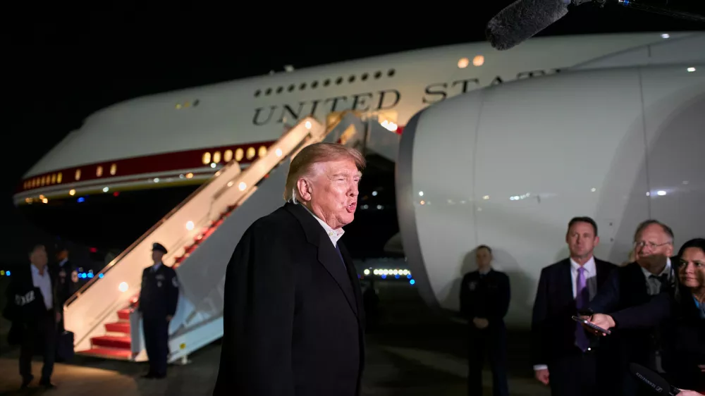 President Donald Trump speaks with reporters as he arrives on Air Force One, Wednesday, Oct. 28, 2026, at Joint Base Andrews, Md. (AP Photo/Alex Brandon)
