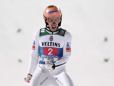 Stefan Kraft, of Austria, reacts after landing his second round jump at the first stage of the 73rd Four Hills ski jumping tournament in Oberstdorf, Germany, Sunday, Dec. 29, 2024. (AP Photo/Matthias Schrader)