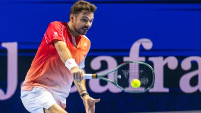 Switzerland's Stan Wawrinka returns a shot to Czech Republic's Jiri Lehecka during the first round of the Swiss Indoors tennis tournament in Basel, Switzerland, Tuesday, Oct. 27, 2026. (Georgios Kefalas/Keystone via AP)