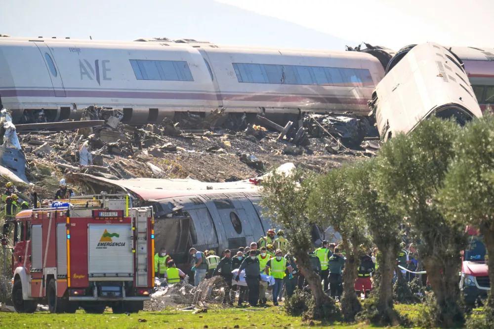 Emergency services work at the scene of a collision between two trains in Urda, Spain, Wednesday, Oct. 28, 2026. (AP Photo/Manu Fernandez)