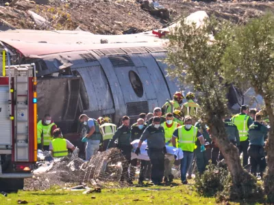 Emergency services attend to the victims at the scene of a collision between two trains in Urda, Spain, on Wednesday, Oct. 28, 2026. (AP Photo/Manu Fernandez)