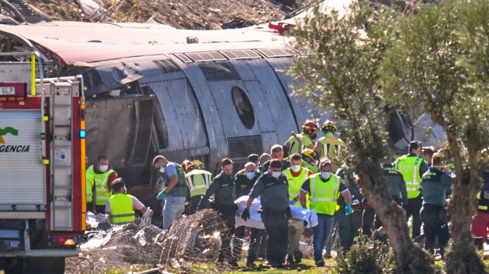 Emergency services attend to the victims at the scene of a collision between two trains in Urda, Spain, on Wednesday, Oct. 28, 2026. (AP Photo/Manu Fernandez)
