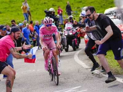 Slovenia's Tadej Pogacar, wearing the pink jersey of the race overall leader, pedals during the 20th stage of the Giro d'Italia cycling race from Alpago to Bassano del Grappa, Italy, Saturday, May 25, 2024. (Fabio Ferrari/LaPresse via AP)