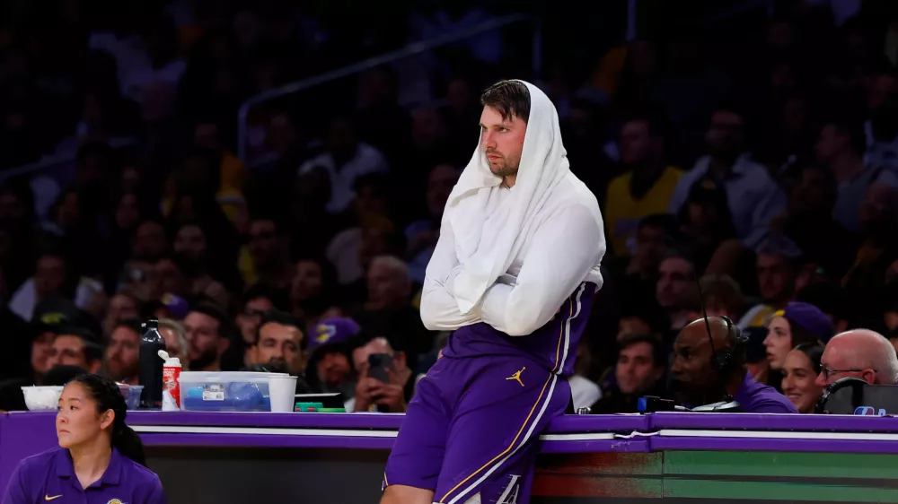 Los Angeles Lakers guard Luka Doncic (77) stands on the sideline during the second half of an NBA basketball game against the Portland Trail Blazers, Tuesday, Oct. 27, 2026, in Los Angeles. (AP Photo/Caroline Brehman)