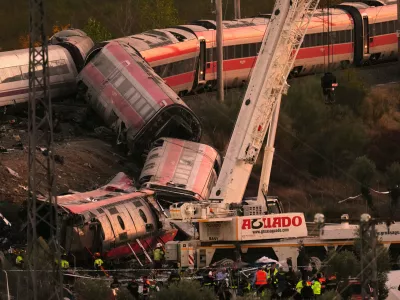 Emergency services work at the scene of a collision between two trains in Urda, Spain, on Wednesday, Oct. 28, 2026. (AP Photo/Manu Fernandez)