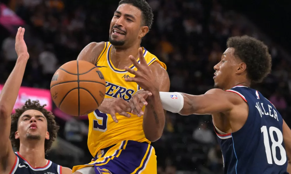 Oct 28, 2026; Inglewood, California, USA; Los Angeles Lakers guard Quentin Grimes (5) is fouled by Los Angeles Clippers forward Baba Miller (18) in the second half at Intuit Dome. Mandatory Credit: Jayne Kamin-Oncea-Imagn Images
