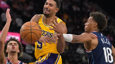 Oct 28, 2026; Inglewood, California, USA; Los Angeles Lakers guard Quentin Grimes (5) is fouled by Los Angeles Clippers forward Baba Miller (18) in the second half at Intuit Dome. Mandatory Credit: Jayne Kamin-Oncea-Imagn Images