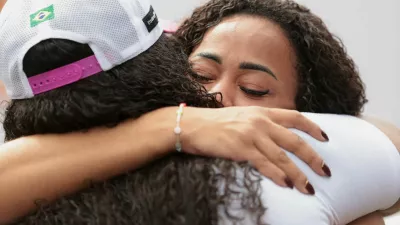 People embrace on the day of a protest to mark the one-year anniversary of a police operation that resulted in 122 deaths, in Rio de Janeiro, Brazil, October 28, 2026. REUTERS/Tita Barros