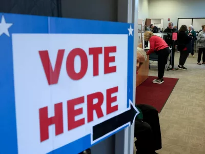 FILE PHOTO: People cast ballots and register as early voting begins in Ohio, with former US Senator Sherrod Brown (D-OH) and Senator Jon Husted (R-OH) engaged in the second-most-expensive Senate race in the country, inside the Medina County Board of Elections in Medina, Ohio, US, October 6, 2026. REUTERS/Shannon Stapleton/File Photo
