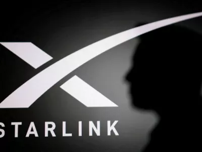 FILE PHOTO: The silhouette of Elon Musk and Starlink logo are seen in this illustration taken June 11, 2026. REUTERS/Dado Ruvic/Illustration/File Photo