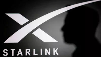 FILE PHOTO: The silhouette of Elon Musk and Starlink logo are seen in this illustration taken June 11, 2026. REUTERS/Dado Ruvic/Illustration/File Photo