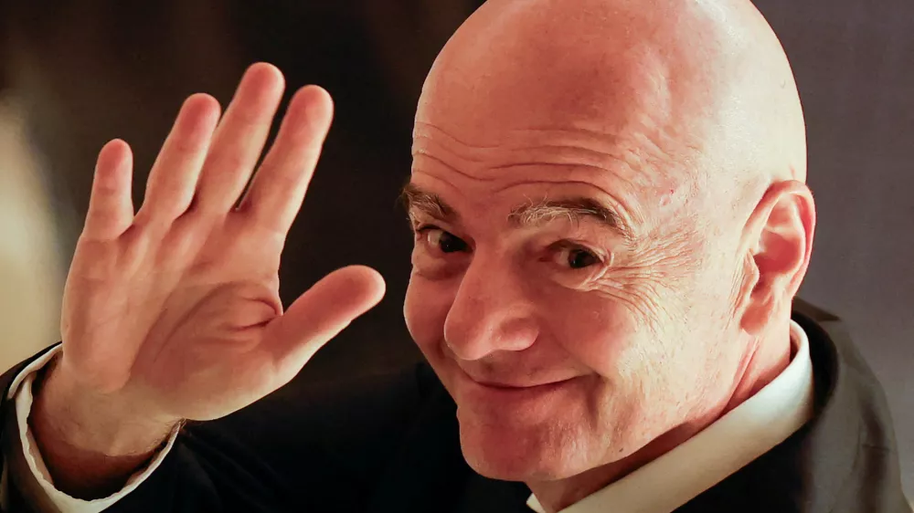 FILE PHOTO: FIFA president Gianni Infantino waves to reporters as he leaves from a venue for the Asian Football Confederation (AFC)'s extraordinary congress in Tokyo, Japan, October 23, 2026. REUTERS/Kim Kyung-Hoon/File Photo