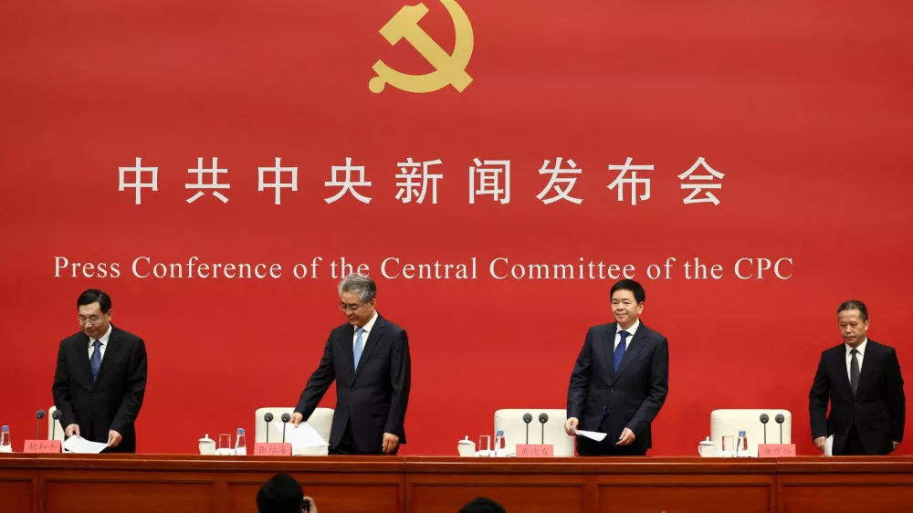 Zhang Fuhai, Deputy Secretary of the Central Commission for Discipline Inspection of the CPC, Huang Jianfa, Executive Vice Minister of the Organization Department of the CPC Central Committee, Hu Heping, Executive Vice Minister of the Publicity Department of the CPC Central Committee, and Tang Fangyu, Director of the Policy Research Office of the CPC Central Committee, take their seats at a press conference following the fifth plenary session of the 20th CPC Central Committee in Beijing, China, October 30, 2026. REUTERS/Maxim Shemetov REFILE - QUALITY REPEAT