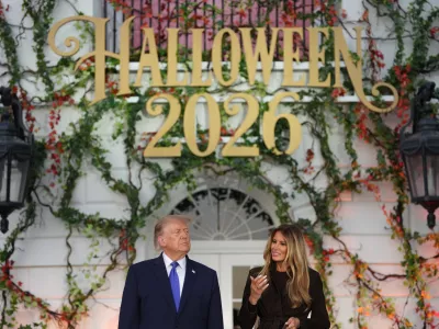 President Donald Trump and first lady Melania Trump attend a Halloween event on the South Lawn of the White House, Thursday, Oct. 29, 2026, in Washington. (AP Photo/Mark Schiefelbein)
