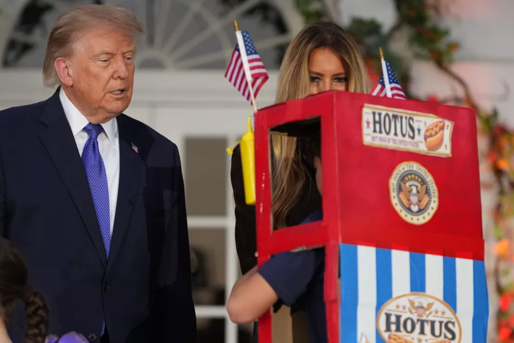 President Donald Trump and first lady Melania Trump attend a Halloween event on the South Lawn of the White House, Thursday, Oct. 29, 2026, in Washington. (AP Photo/Mark Schiefelbein)