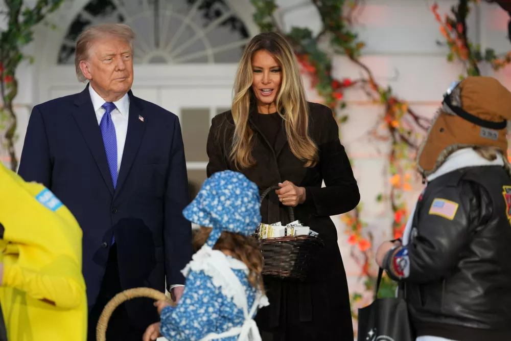 President Donald Trump and first lady Melania Trump attend a Halloween event on the South Lawn of the White House, Thursday, Oct. 29, 2026, in Washington. (AP Photo/Mark Schiefelbein)