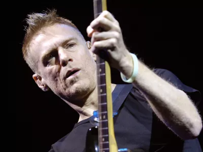 Canadian rock singer, guitarist and songwriter Bryan Adams performs during his Anthology Tour at Sazka Arena in Prague on Sunday, Nov. 19, 2006. (AP Photo/CTK, Rene Volfik) ** SLOVAKIA OUT **