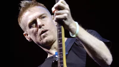 Canadian rock singer, guitarist and songwriter Bryan Adams performs during his Anthology Tour at Sazka Arena in Prague on Sunday, Nov. 19, 2006. (AP Photo/CTK, Rene Volfik) ** SLOVAKIA OUT **
