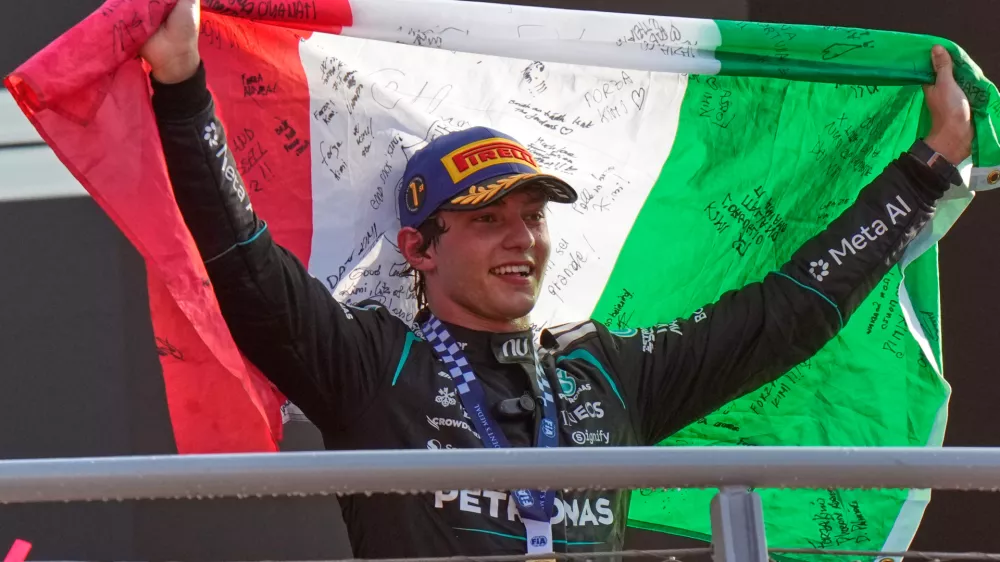 FILE - Mercedes driver Andrea Kimi Antonelli, of Italy, celebrates on the podium after winning the Italian Formula One Grand Prix race in Monza, Italy, Sept. 6, 2026. (AP Photo/Luca Bruno, File)