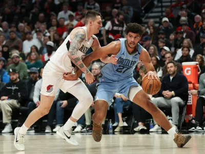 Memphis Grizzlies forward Cameron Boozer, right, drives to the basket as Portland Trail Blazers guard V&iacute;t Krejč&iacute;, left, defends during the first half of an NBA basketball game Thursday, Oct. 29, 2026, in Portland, Ore. (AP Photo/Amanda Loman)