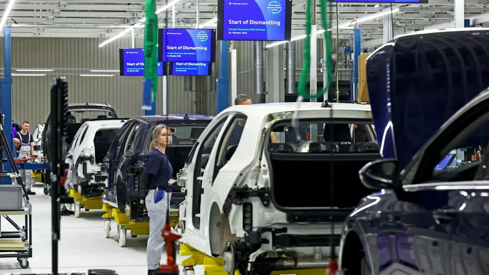 Employees of Volkswagen work at the group's first Circular Economy facility to dismantle cars, at Volkswagen's EV factory in Zwickau, Germany, October 28, 2026. REUTERS/Lisi Niesner