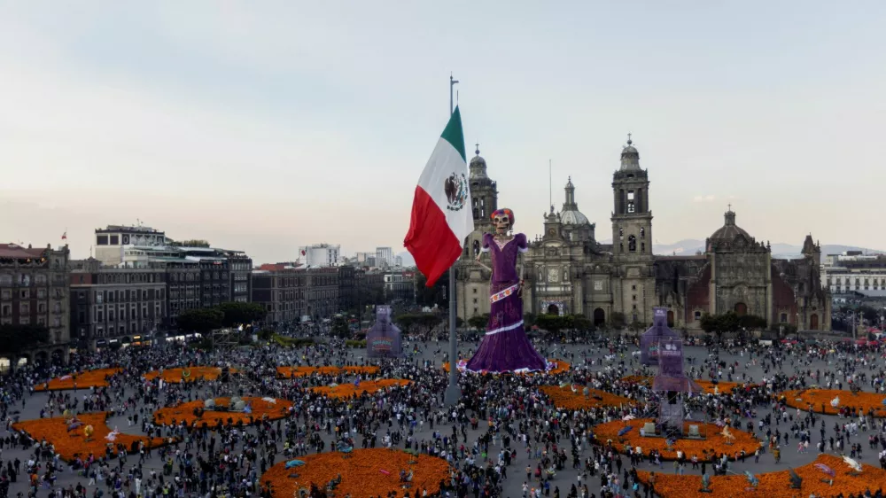 A more than 30-metre (98-foot) tall "Catrina" sculpture, a skeletal figure associated with Mexico's Day of the Dead traditions, is displayed at Mexico City's Zocalo square ahead of Day of the Dead celebrations, in Mexico City, Mexico, October 30, 2026. REUTERS/Quetzalli Nicte-Ha  REFILE - QUALITY REPEAT