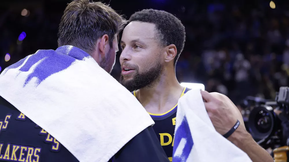 Oct 30, 2026; San Francisco, California, USA; Los Angeles Lakers guard Luka Doncic (77) and Golden State Warriors guard Stephen Curry (30) greet each other after the game during the fourth quarter at Chase Center. Mandatory Credit: Kelley L Cox-Imagn Images