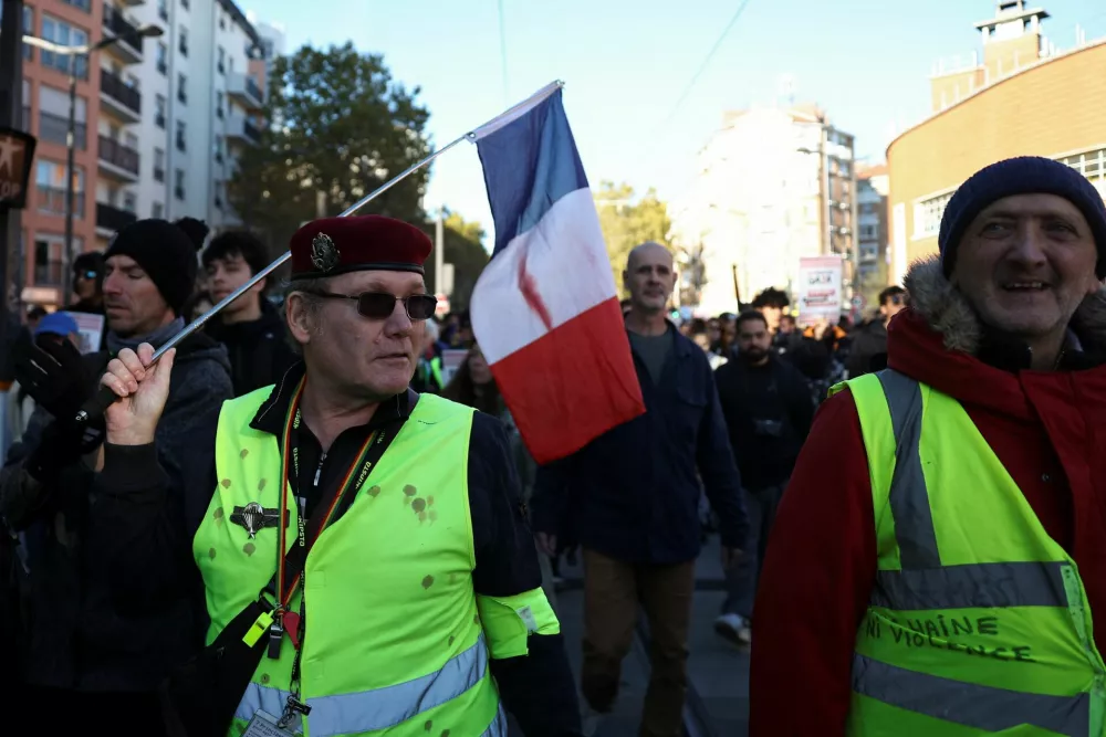 People take part in a demonstration organised by labour unions as part of nationwide protests called by the "Yellow Vests" movement joined by French high school and university students against the cost of living and rising fuel prices, in Paris, France, October 31, 2026. REUTERS/Abdul Saboor