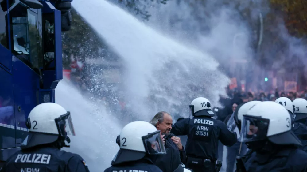 Police use water canons during a nationwide protest by campaign group Gen Z regelt (Gen Z takes charge) against underfunding of schools, cuts to education, social services, culture and healthcare, rising living costs, and military conscription, in Cologne, Germany, October 31, 2026. REUTERS/Thilo Schmuelgen