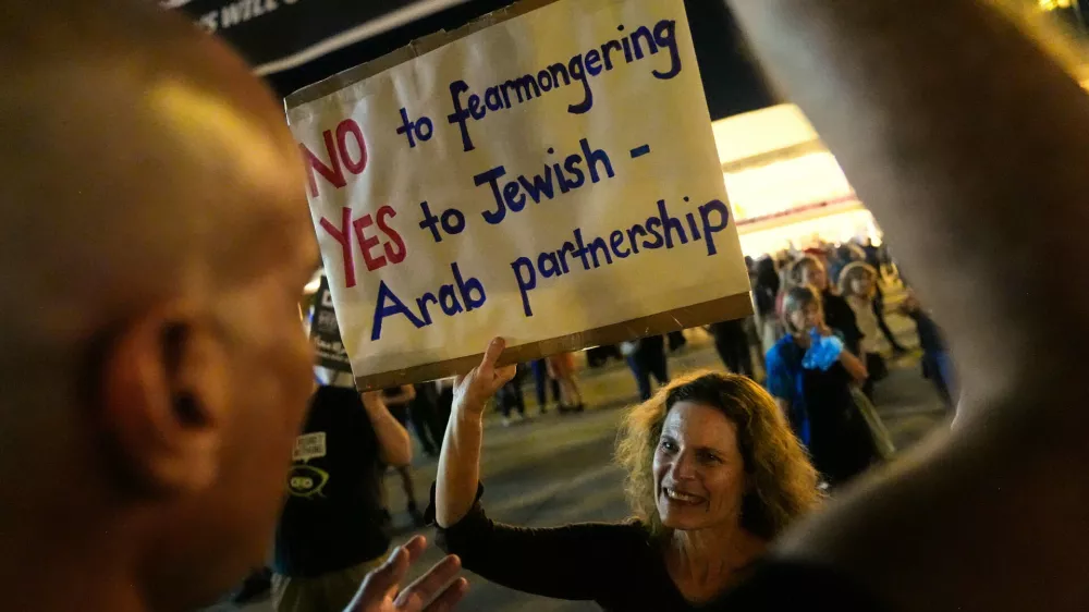 People call for the formation of a Jewish-Arab government during a protest following Israel's general election in Tel Aviv, Israel, Saturday, Oct. 31, 2026. (AP Photo/David Goldman)